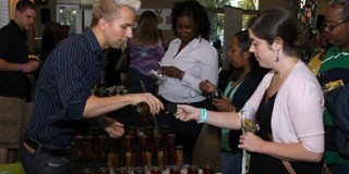 John Wright helps honey tasters at Grape/Wine Event.