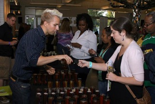 John Wright helps honey tasters at Grape/Wine Event.