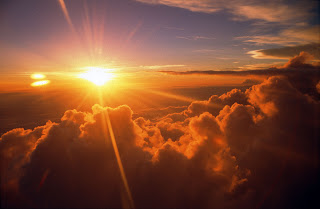 Sunrise over Clouds with Blue Sky