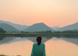 Woman Meditating in Personal Peace near Lake